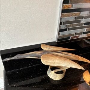 Unique hand carved bird made out of animal horn